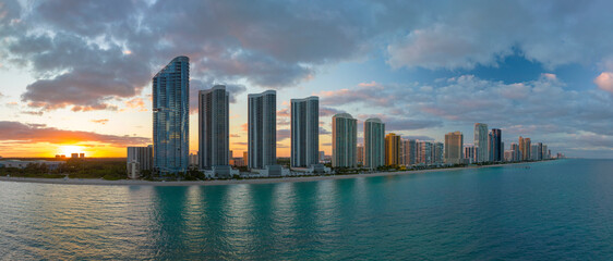View from above of luxurious highrise hotels and condos on Atlantic ocean shore in Sunny Isles...