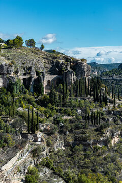 Rocky hillside with pathways and trees in Cuenca, Spain