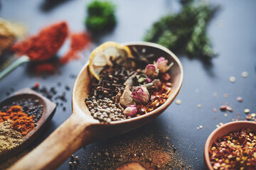 Table, spoon and group of seeds for seasoning, abstract and ingredients for flavor on background. Chili, cooking and collection of herbs or organic plant, textures and culinary condiments for food