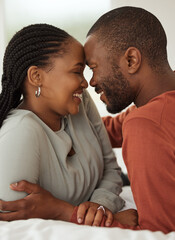 Black couple, forehead and touch with love in bedroom for embrace, bonding together and marriage loyalty. Smile, people and morning romance with partner, healthy relationship and commitment at house