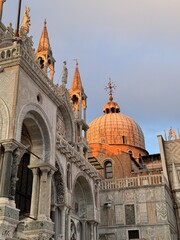 Evening light on the historic architecture of St. Mark's Basilica in Venice, Italy