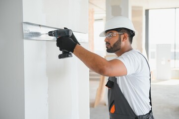 man fasten metal profile frame to the wall for draywall bulkhead