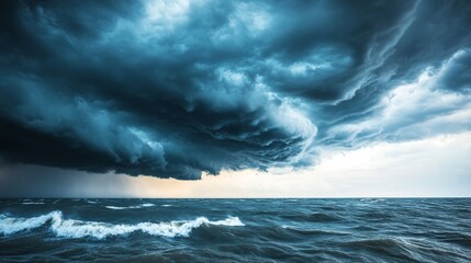 Fototapeta premium Ominous clouds gather overhead as the calm sea prepares for an impending storm