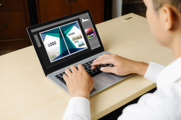 Graphic designer software for modern design of web page and commercial ads showing on the computer screen