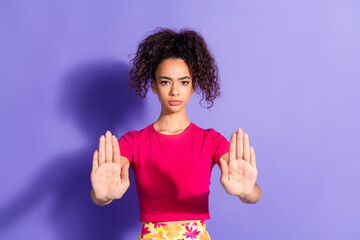 Photo of serious confident woman wear pink top showing palms asking stop empty space isolated...