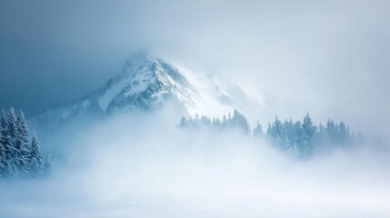 Obraz premium A tranquil mountain landscape shrouded in a heavy blizzard with snow blanketing the trees