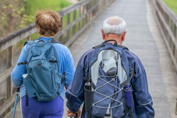 senior couple hiking outdoors in nature