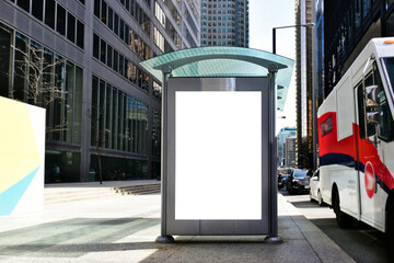 bus shelter with blank ad panel. billboard display. empty white lightbox sign at bus stop. billboard mockup. glass structure. city transit station. North American urban street. outdoor advertising.