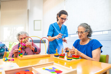 Elderly people playing skill games in the nursing home