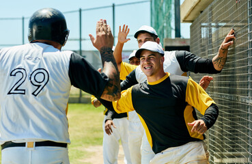 Fototapeta premium High five, sports and baseball team at game on field cheering for group winning, score or achievement. Happy, celebration and male athletes at stadium with energy for home run in outdoor match.