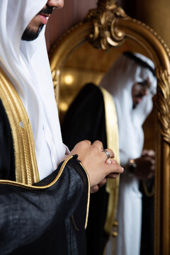 Groom putting on his wedding ring