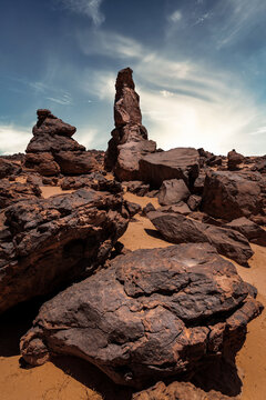 Small rock formations under blue sky in Al Ula