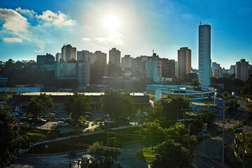 Fototapeta premium Architecture, buildings and city with blue sky background for business, commercial or infrastructure. Office, real estate and skyscraper premises in urban development for downtown metropolis