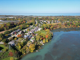 Aerial over Martindale Pond near Henley Island viewing north towards Port Dalhousie and Lake Ontario in St. Catharines, Ontario, Canada on a sunny Autumn day in October, 2024.