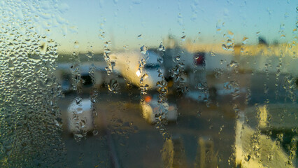 Condensation on windows of airpoirt terminal at sunrise
