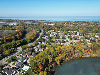 Aerial over Richardson's Creek and Port Dalhousie area viewing northwest from Martindale Pond near Martindale and Lake Ontario in north St. Catharines, Ontario, Canada on a sunny Autumn day in October