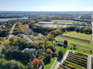 Aerial over Martindale, suburban and agricultural area of north St. Catharines, Ontario, Canada and Martindale Pond near the Port Dalhousie area, viewing southeast from Louth on a sunny Autumn day.