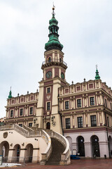 Obraz premium Town Hall in Great Market Square in Zamosc, Poland. Zamosc is an example of a Renaissance town in Central Europe designed with Italian theories of ideal town, UNESCO