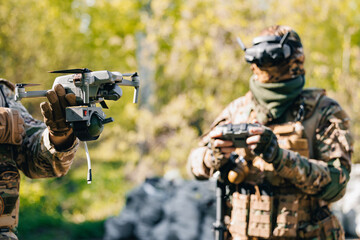 Soldier UAV operator launches army drone with bomb to drop into enemy fortifications and trenches....