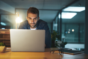 Business man, laptop and office at night with deadline, email and working on creative project. Professional, web designer and online job with digital and seo design update for company website