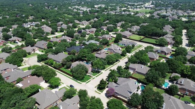 Brand new two-story suburban houses with large backyard, swimming pools, grassy lawn, lush greenery trees in upscale residential neighborhood of Flower Mound, Dallas Fort Worth metroplex, flyover