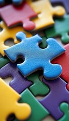 Fototapeta premium Colorful Jigsaw Puzzle Pieces With Focus on Blue Piece Business Concept for Background