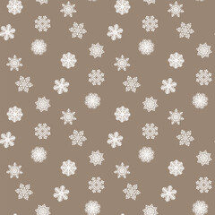 White snowflakes on a colored background of wrapping paper. Christmas holidays concept.