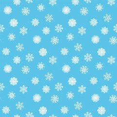 White snowflakes on a colored background of wrapping paper. Christmas holidays concept.