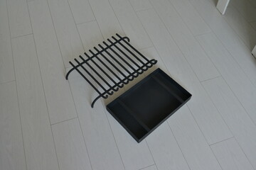 A subject photo shoot of black grilles for fireplaces.