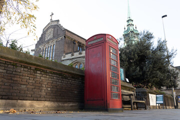 Old classic red British phone box booth in London England