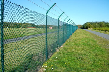 Simple security fence at a military airport for large transport aircraft of the German Air Force....
