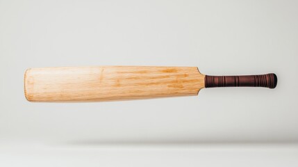 Naklejka premium Single Floating Cricket Bat on White Background