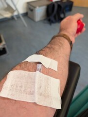 arm of a man who donates blood
