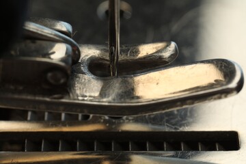 Macro view of one metal sewing machine