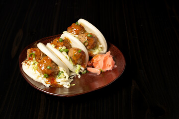 Three Bao Buns with Vegetarian BBQ meatballs and sauce