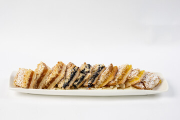 Sweet and savory squares on a bed of slivered almonds