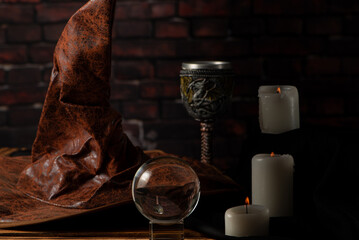 Lighted candles, scene with various objects and recently extinguished candles. Selective focus.