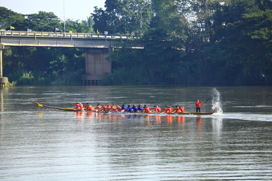 Unidentified crew in traditional Thai long boats compete during Queen Cup Traditional Long Boat Race Championship in Photharam Ratchaburi, Thailand