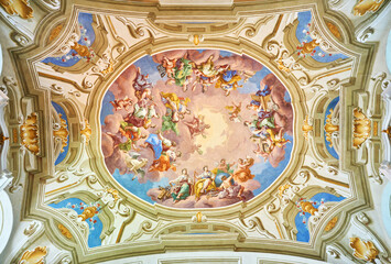 Admont library, Austria, 25 July 2024. A grand baroque library with a ceiling mural.