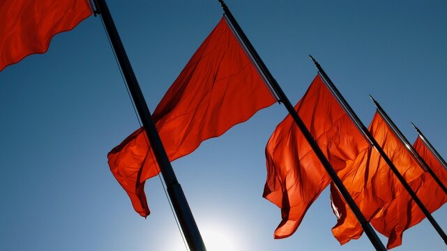 Red flags flutter in the breeze