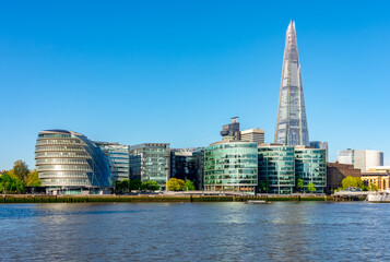 Shard skyscraper and City Hall building in Southwark along Thames river, London, UK