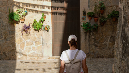 Woman Exploring the Historic Streets of Valdemossa on Mallorca Island, Spain