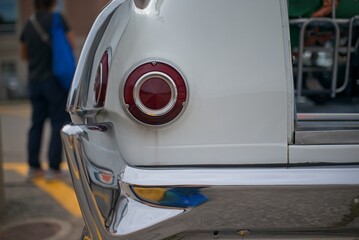 Fototapeta premium Close-up of Vintage Car Tail Light and Bumper