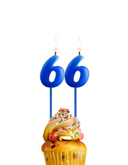 Blue number 66 candle - Birthday card on a white background.