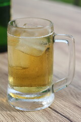 full glass of beer on table at the restaurant