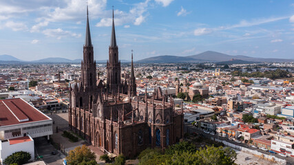 Zamora, Michoac&aacute;n, Mexico - December 24, 2023: Afternoon light shines on a historic church in the heart of downtown Zamora.