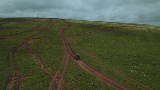 Aerial photography of car movement in the mountains, SUV driving on a mountain road, aerial photography of a road in the North Caucasus, aerial photography of a road in the mountains, lada niva travel