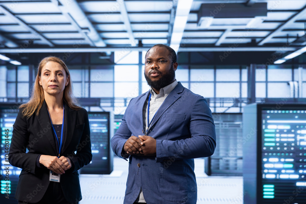 Poster teamworking supervisors overseeing data center after configuring network infrastructure such as rout