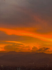 Beautiful orange sky background in the city. Medellin, Colombia. 