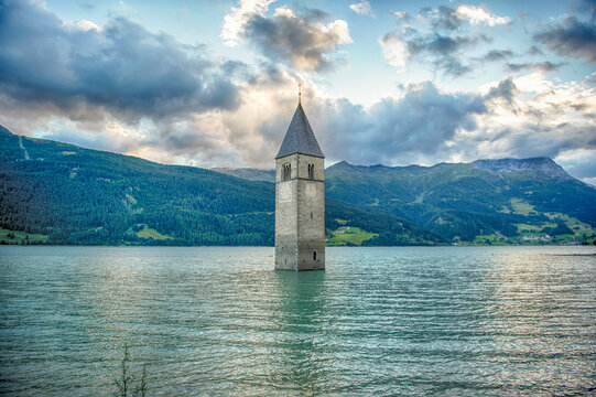 The iconic submerged Church Tower of Graun, Lake Reschensee, Italy